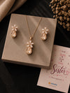 Crystal floral teardrop necklace and earrings set, laid flat