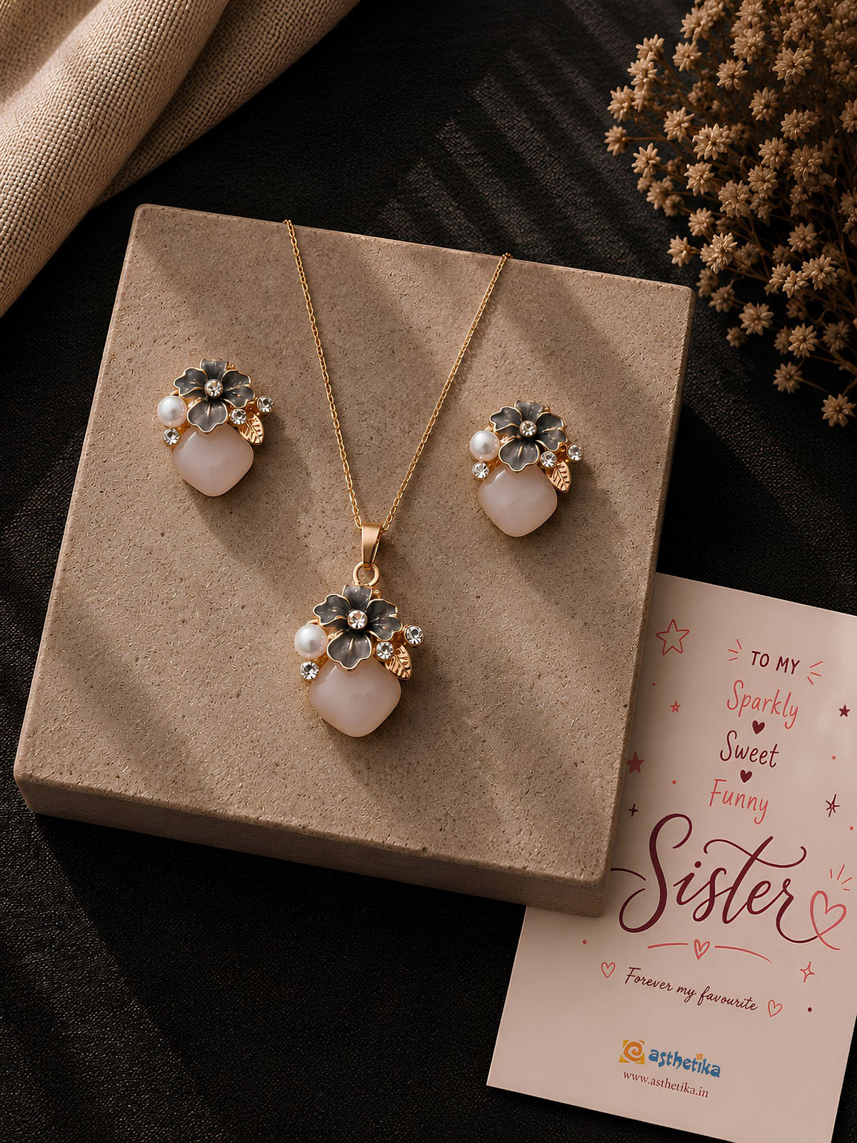 Floral teardrop crystal necklace and earrings set, laid flat