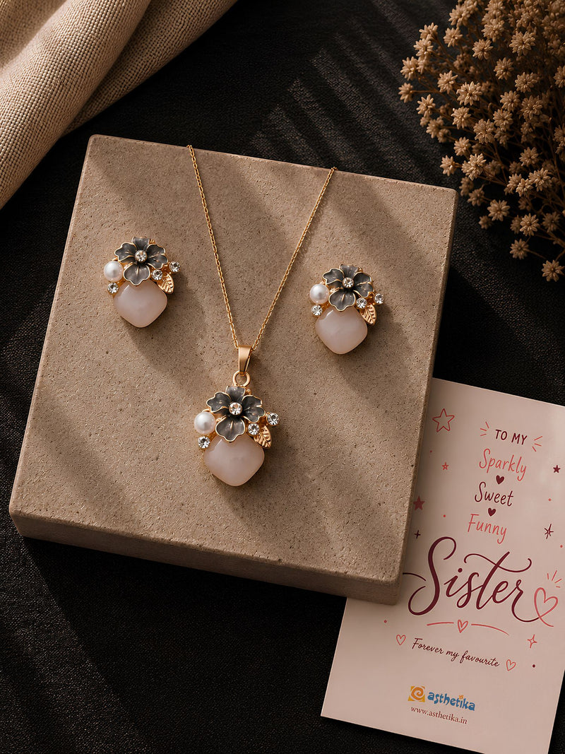 Floral teardrop crystal necklace and earrings set, laid flat