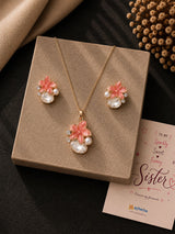 Crystal teardrop floral necklace and earrings set, laid flat