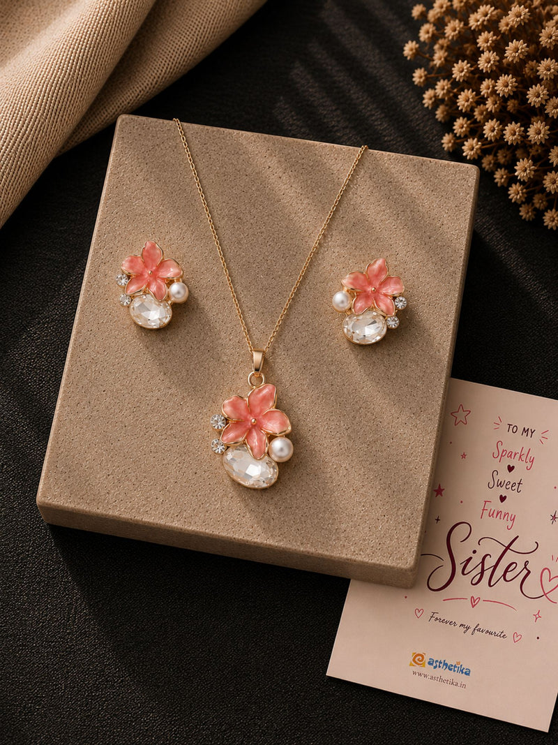 Crystal teardrop floral necklace and earrings set, laid flat
