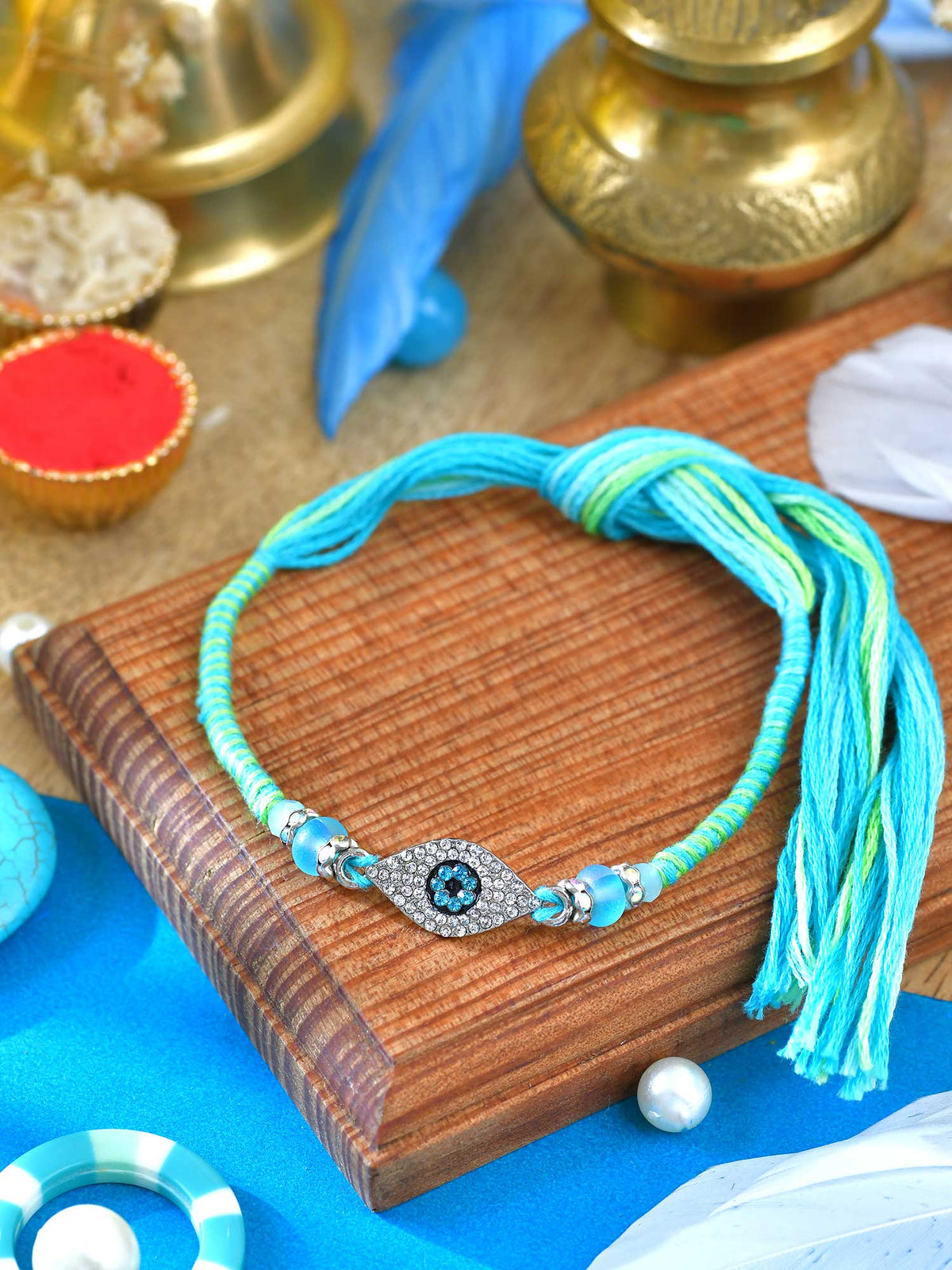 Diamond stone Evil Eye Rakhi with diamond stone Evil Eye charm on a thread cord