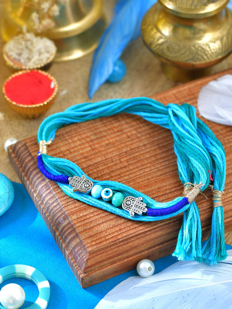 Oxidized Hamsa Evil Eye Rakhi with oxidized Hamsa and Evil Eye charm on a thread cord