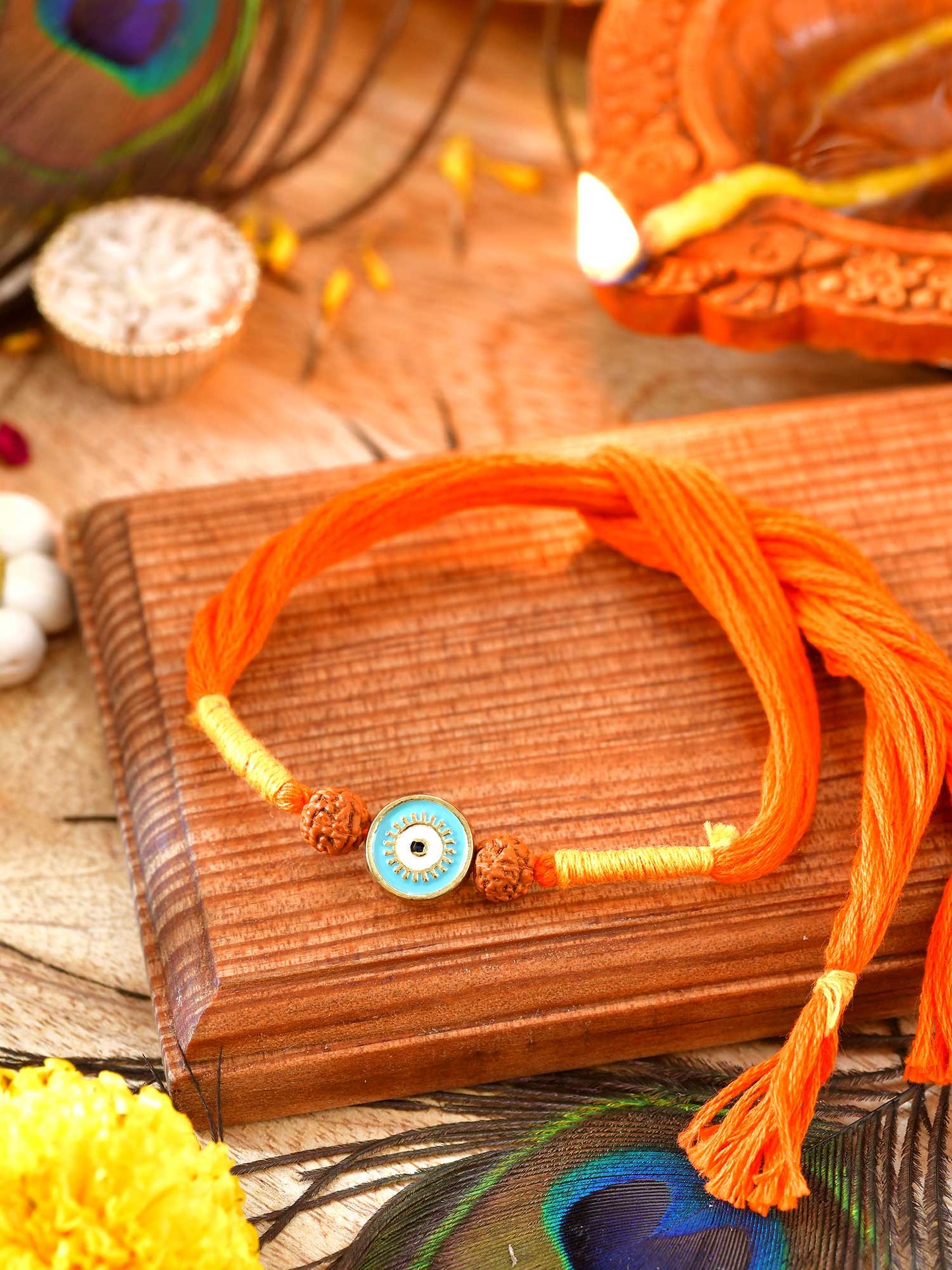 Evil Eye Rudraksh Rakhi with Evil Eye charm and Rudraksha beads on a thread cord