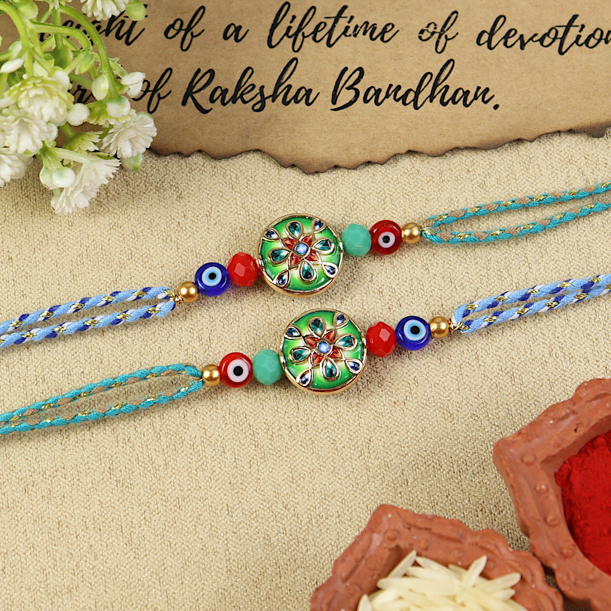Meena Evil Eye Fancy Thread Rakhi, laid flat
