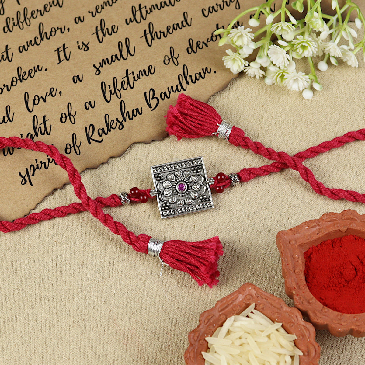 Square Ruby Oxidised Rakhi, laid flat
