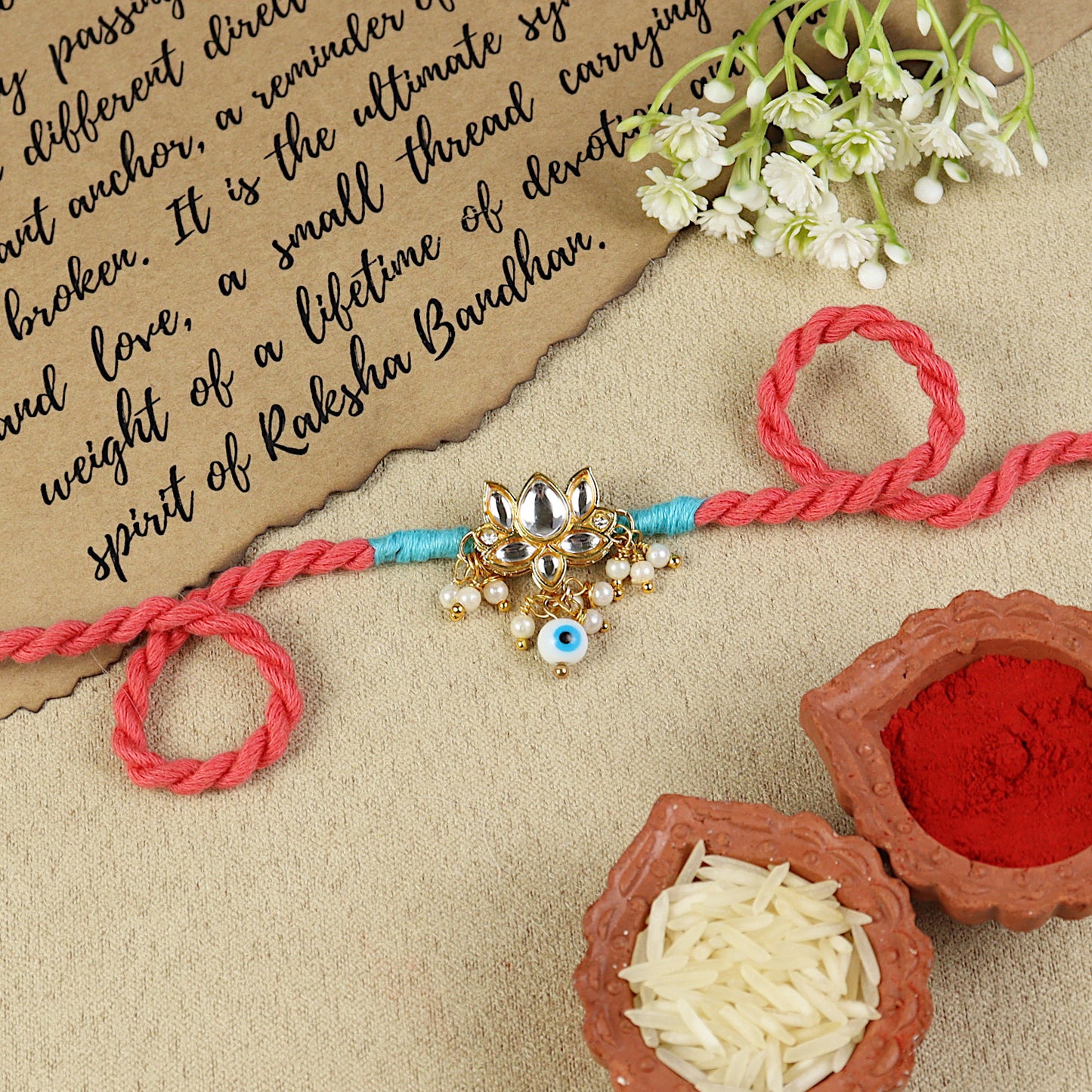 Kundan Lotus Evil Eye Rakhi, laid flat