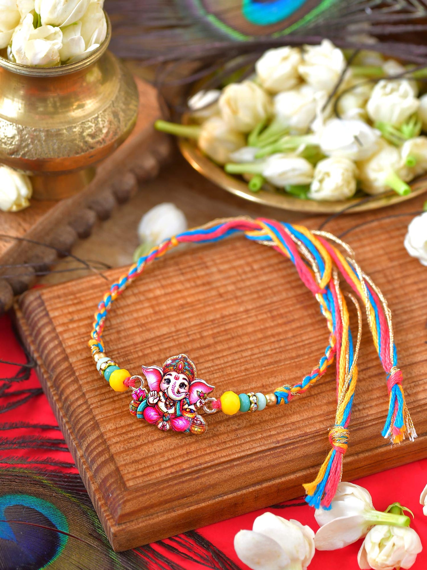 Ganesha Rakhi with Ganesha charm on a thread cord