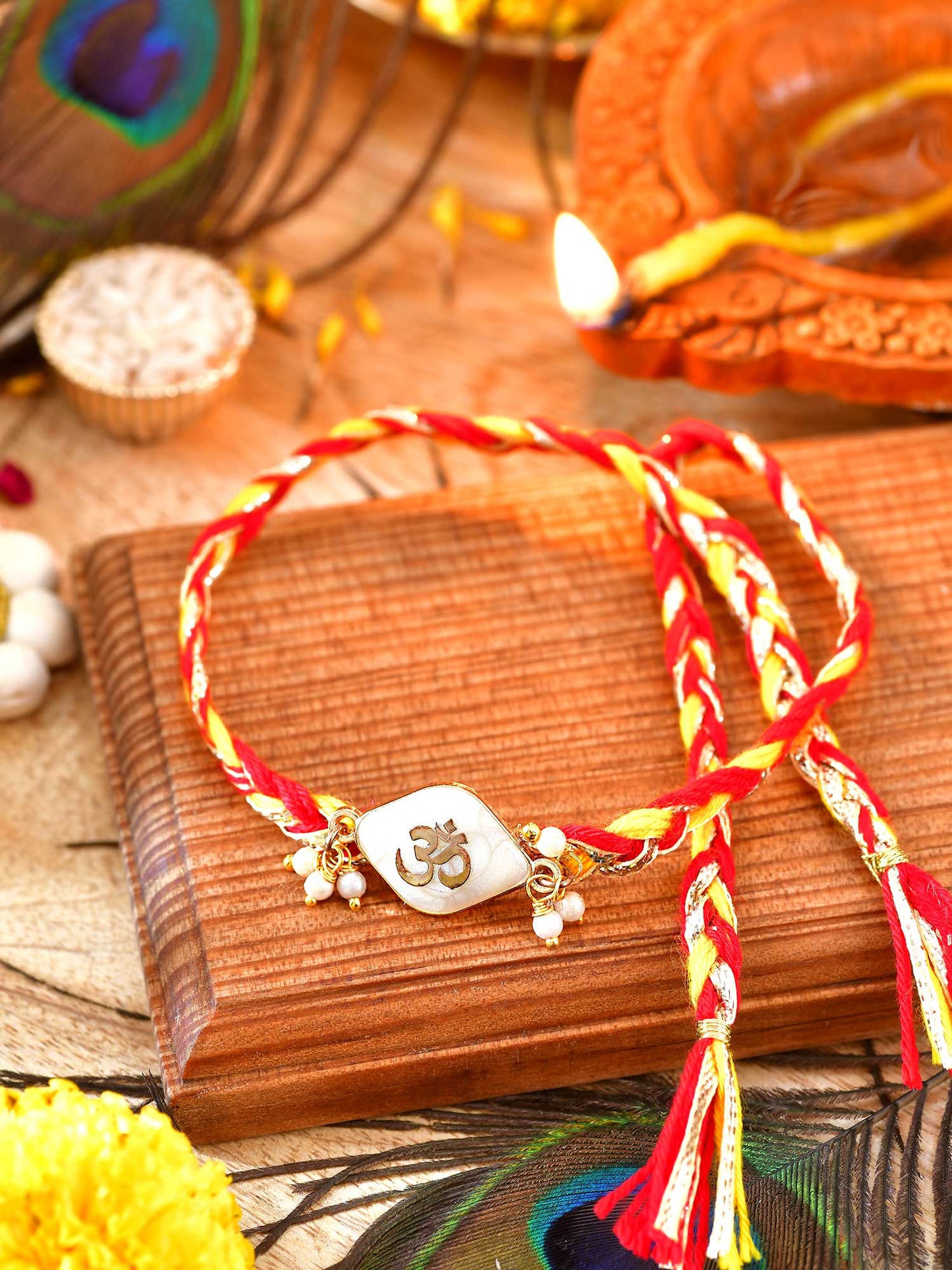 Om Mother of Pearl weaved thread Rakhi with Om motif on a weaved cord