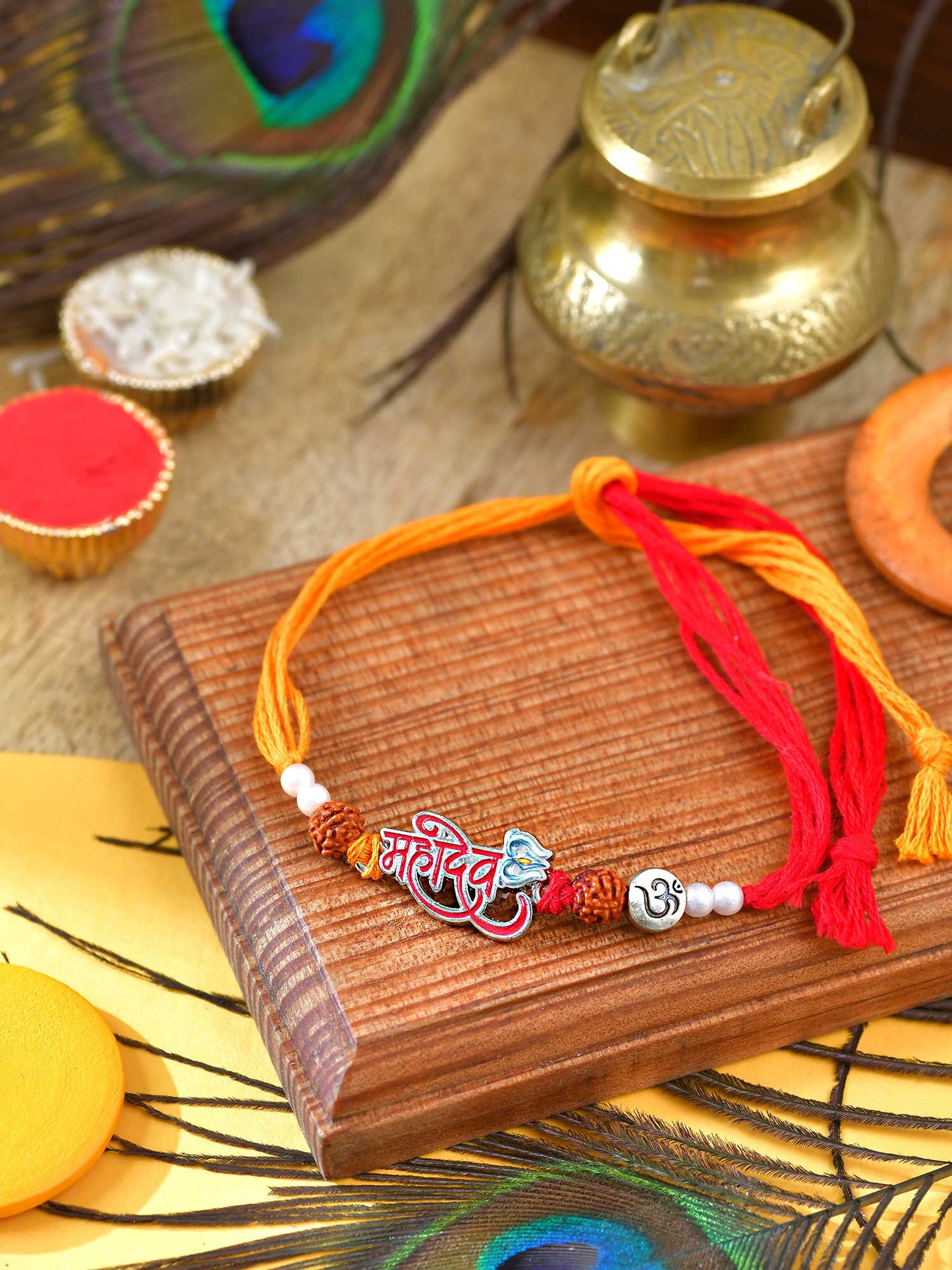 Mahadev Rudraksh Rakhi with metal charm and Rudraksha beads on a thread cord