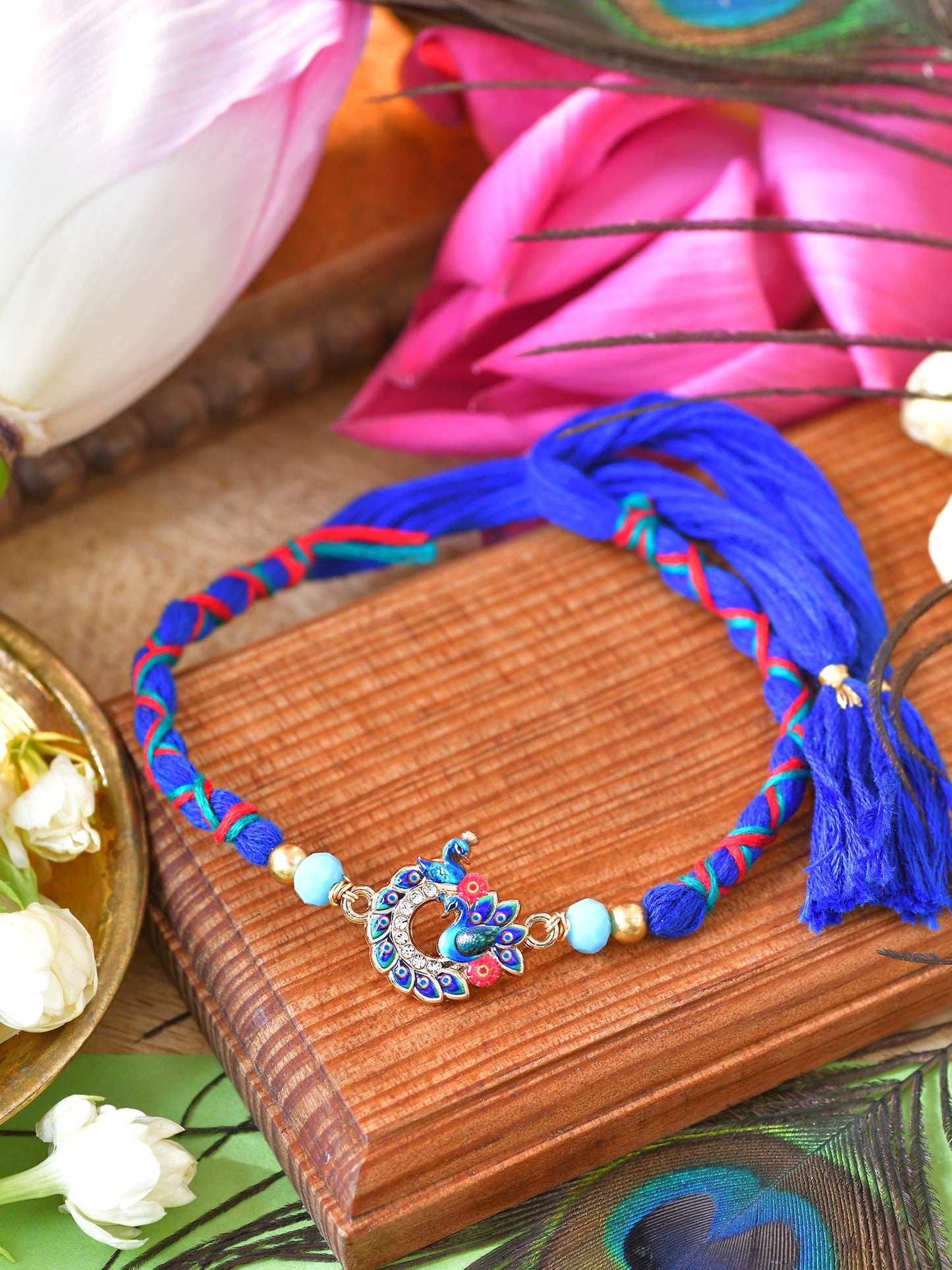 Peacock stone weaved Rakhi with peacock stone and weaved thread cord