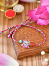 Ganesha charm Rakhi with Ganesha charm on a thread cord
