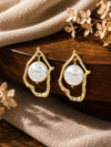 Abstract gold frame earrings with baroque pearl, laid flat
