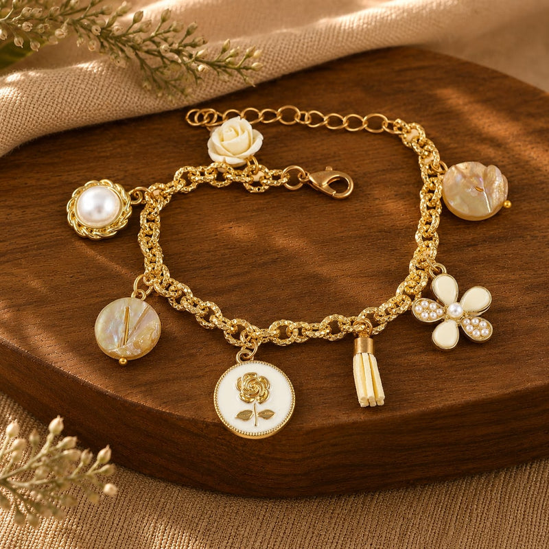 Multi charm mother of pearl bracelet on an adjustable chain, laid flat