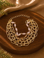 Gold tone chain beaded bracelet on an adjustable chain, laid flat