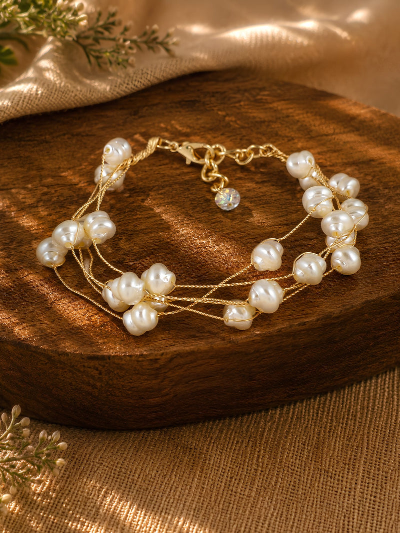 Gold plated pearl multistrand bracelet, strands laid flat