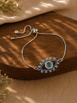 Evil eye diamond pendant bracelet on a chain, laid flat