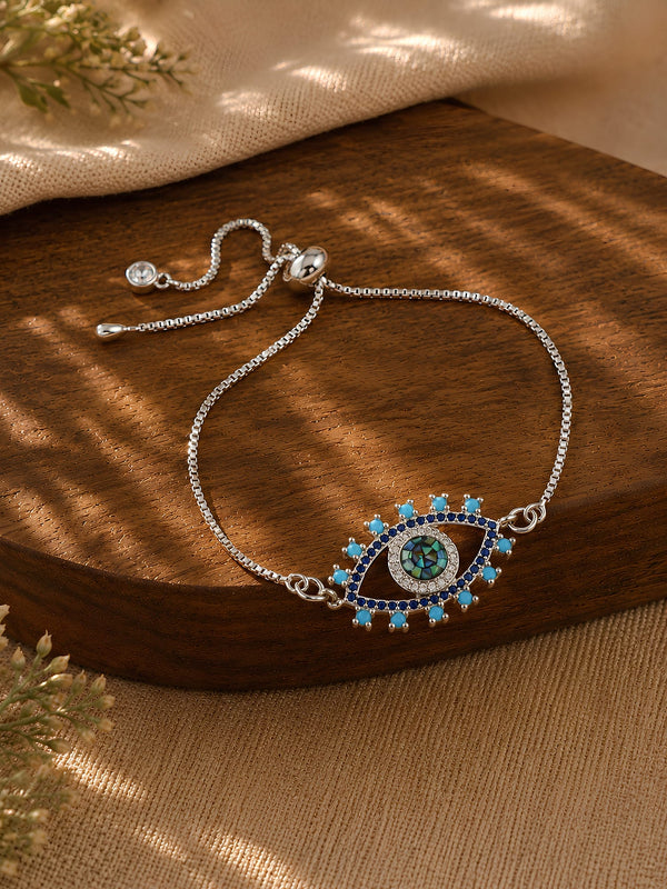 Evil eye diamond pendant bracelet on a chain, laid flat