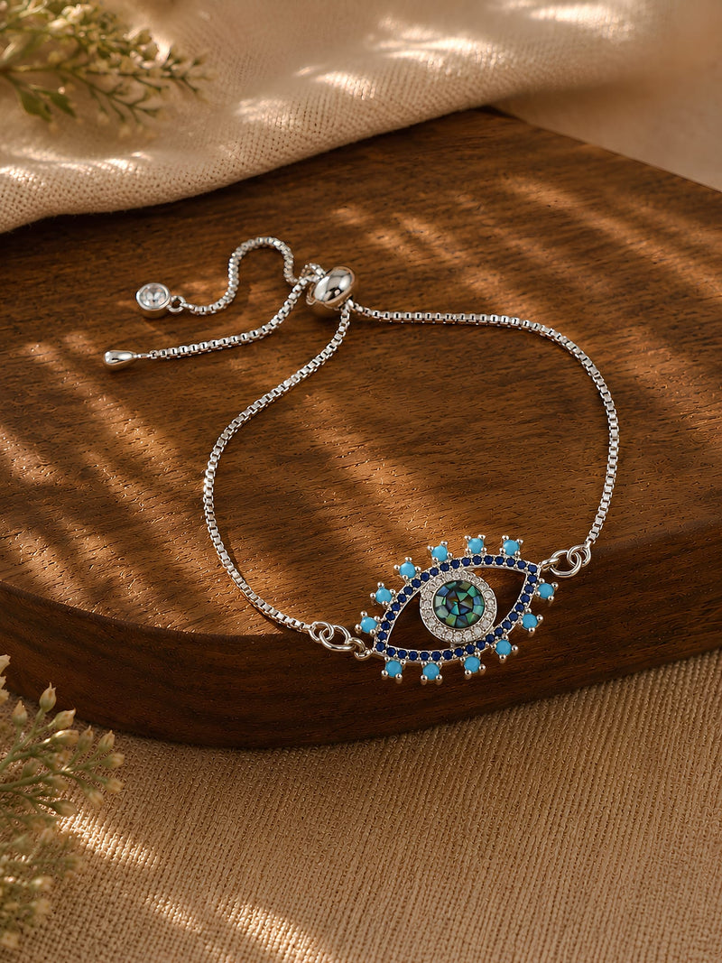 Evil eye diamond pendant bracelet on a chain, laid flat