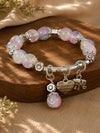 Love and elephant charm beaded bracelet, laid flat