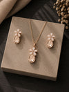 Golden crystal jewellery set — necklace and earrings laid flat