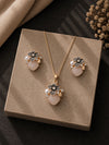 Smoky grey crystal and pearl jewellery set — necklace and earrings laid flat