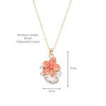 Close-up of the enamel floral charm and crystal setting on the pendant