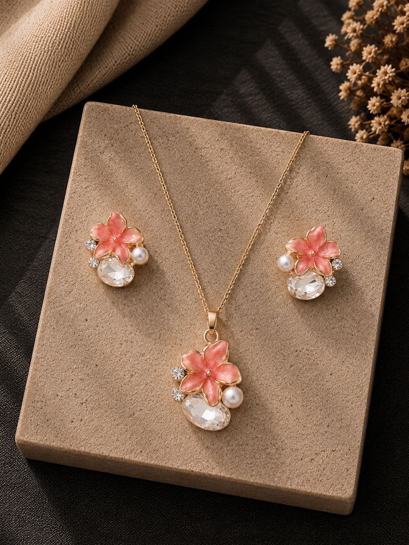 Peach crystal jewellery set — necklace and earrings laid flat