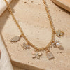 Diamond Stone multi-charm necklace on a chain, laid flat