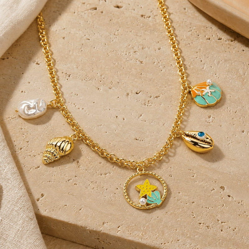 Sea World multi-charm necklace on a chain, laid flat