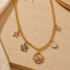 Sea World charm necklace on a chain, laid flat