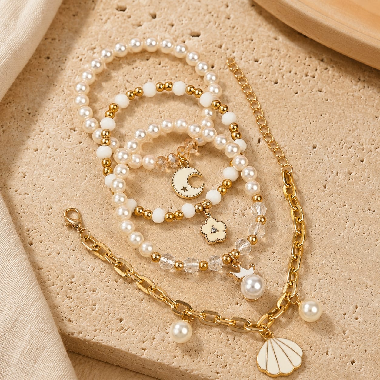 Moon charm bracelet set of 4, beaded and chain styles, laid flat