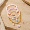 Pastel floral charm bracelet set of 3, beaded and chain styles, laid flat