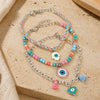 Vibrant beaded Evil Eye charm bracelet set of 3, laid flat