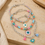 Vibrant beaded Evil Eye charm bracelet set of 3, laid flat