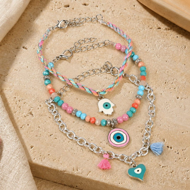 Vibrant beaded Evil Eye charm bracelet set of 3, laid flat