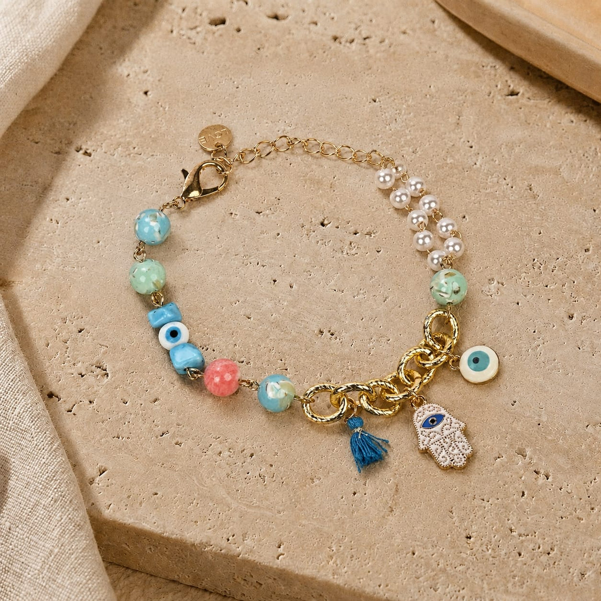 Hamsa Evil Eye charm bracelet, half chain and half bead, laid flat