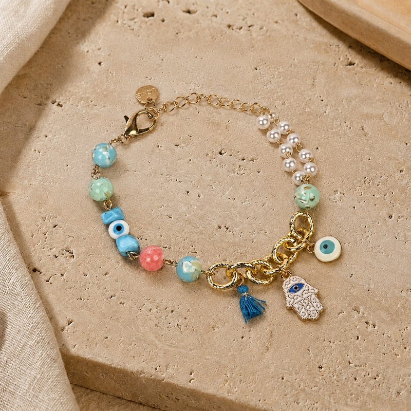 Hamsa Evil Eye charm bracelet, half chain and half bead, laid flat